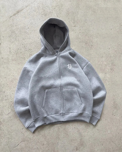 Streetwear Hoodie zippé pour homme et femme, sweat urbain en coton et polyester, coupe ample et confortable, style moderne et rétro.